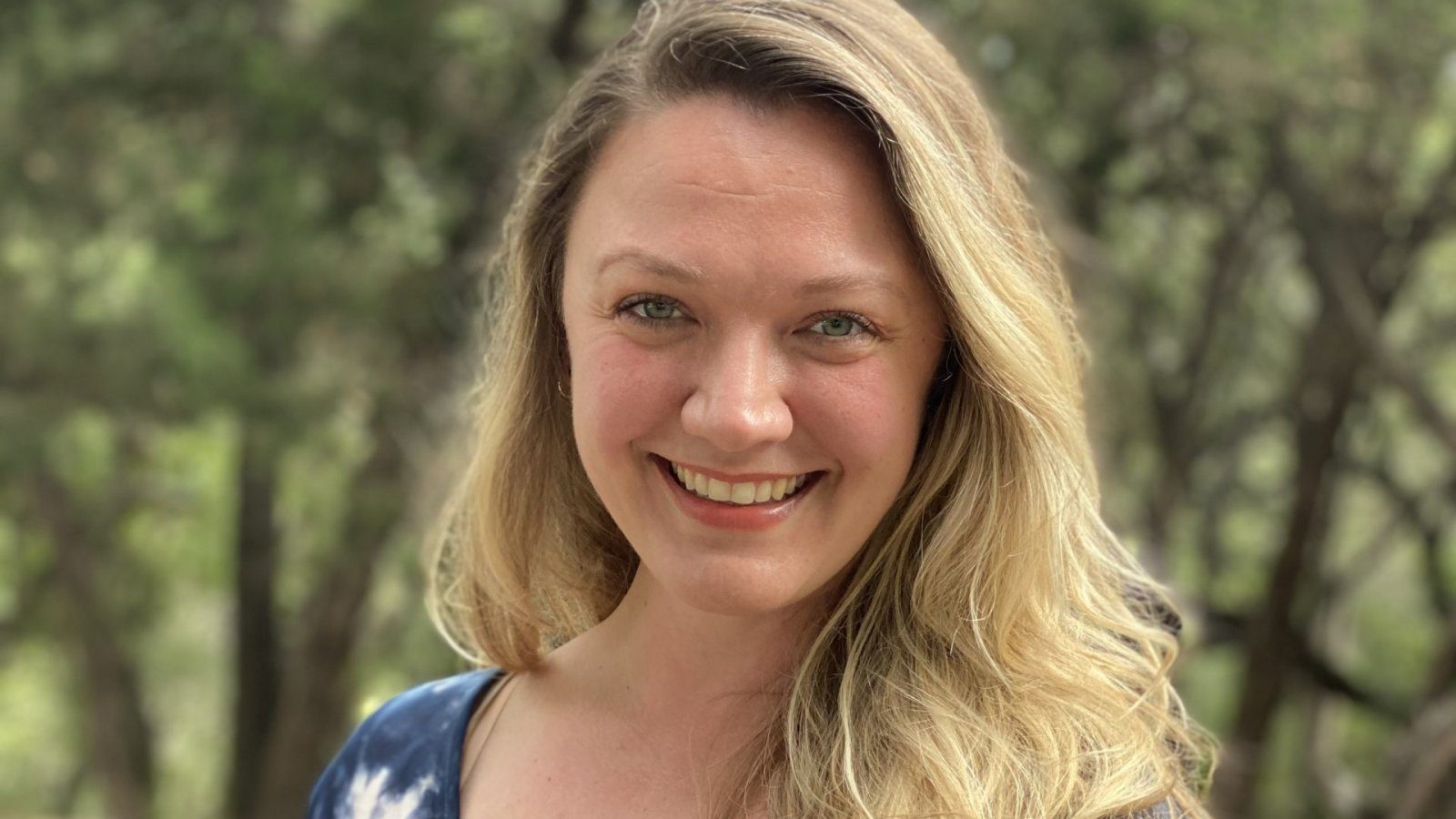 headshot of person smiling at camera