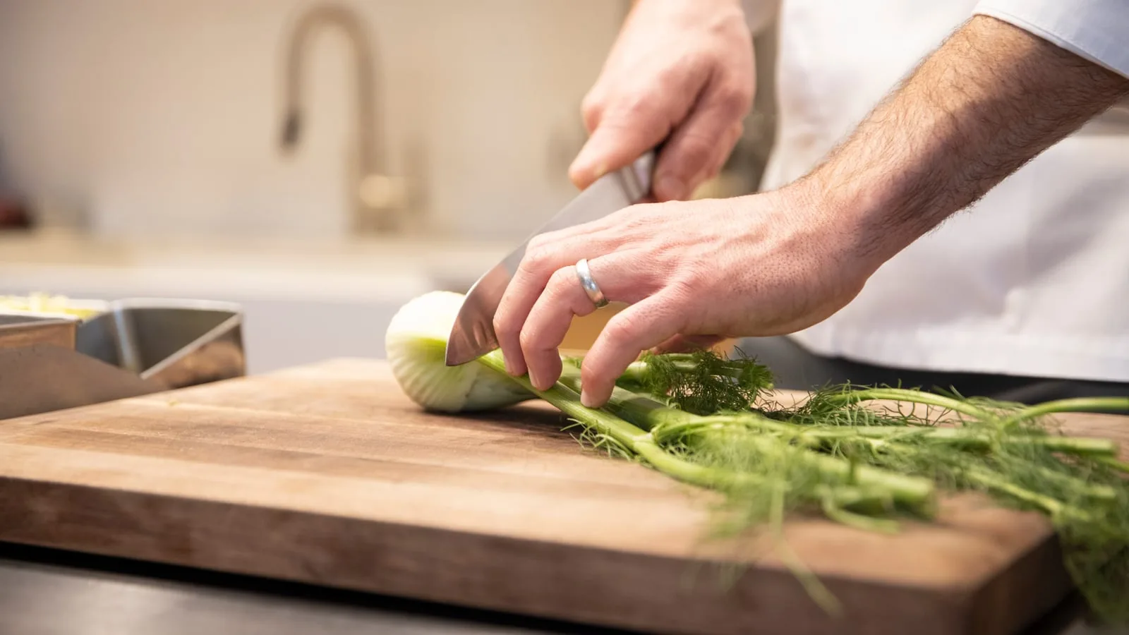 person cutting vegetable