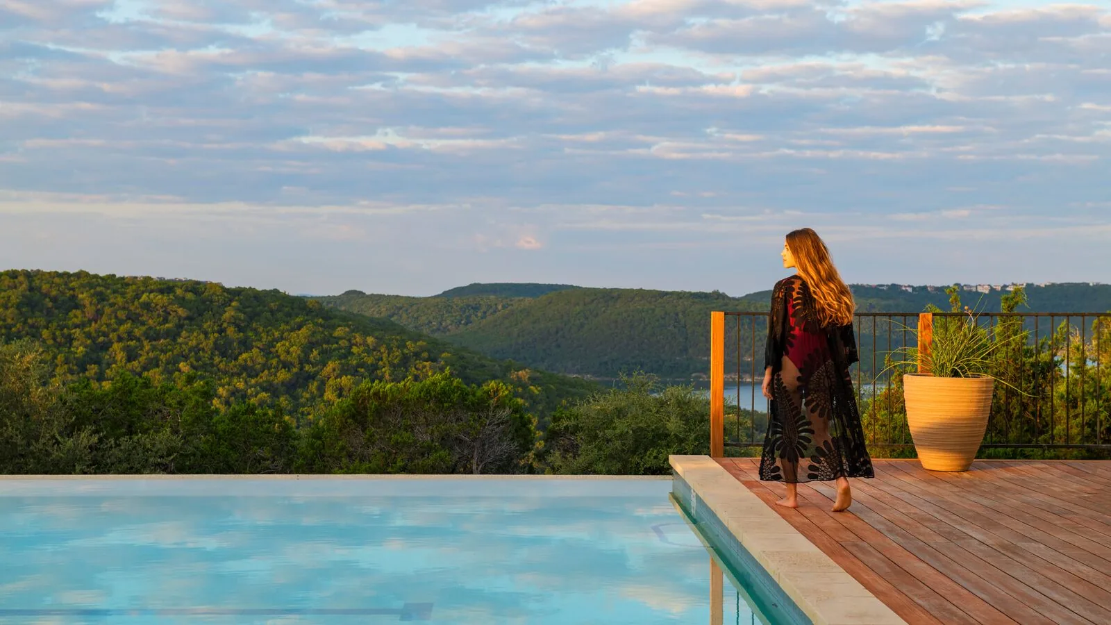 person walking to see landscape by pool