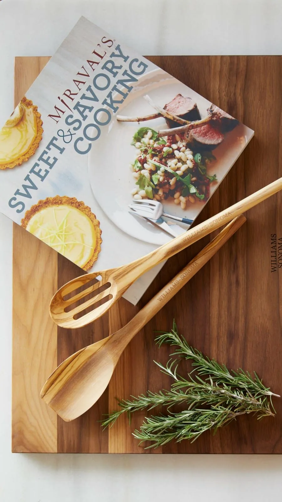 miraval sweet and savory cook book on a wooden cutting board