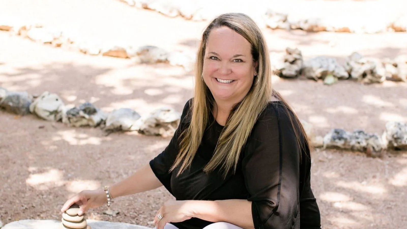 Lori Burdick stacking rocks