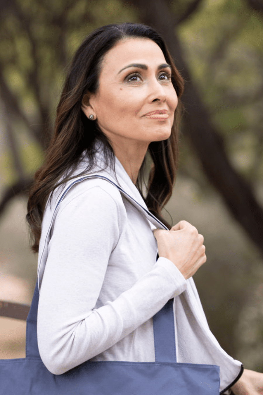 a woman stepping into her dream wellness retreat, surrounded by a serene and inviting atmosphere