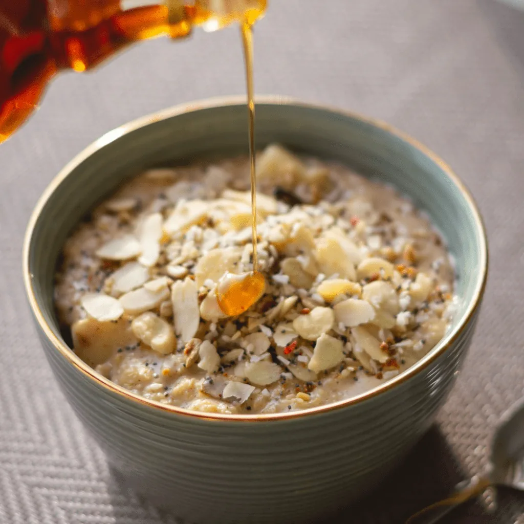 oats and lentils in a bowl with drizzled syrup