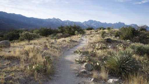 path on a hill towards mountains