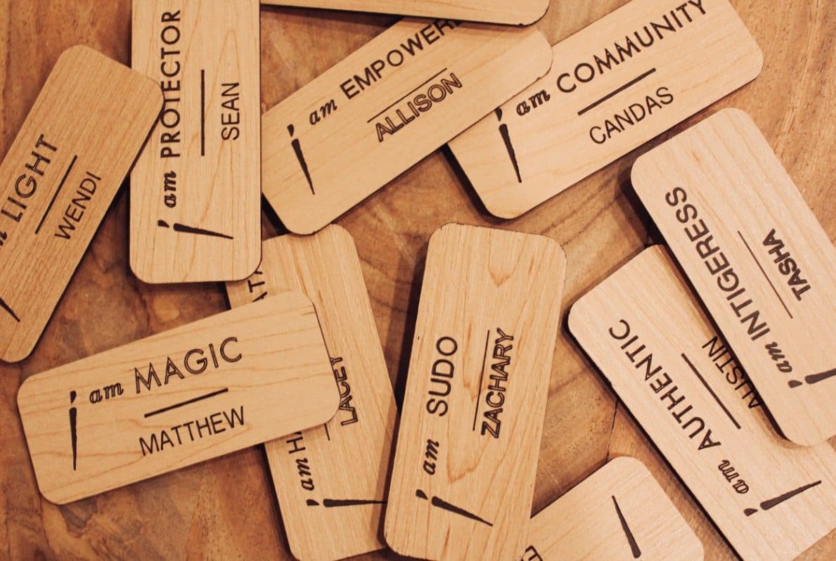 name tags laid out on a wooden table