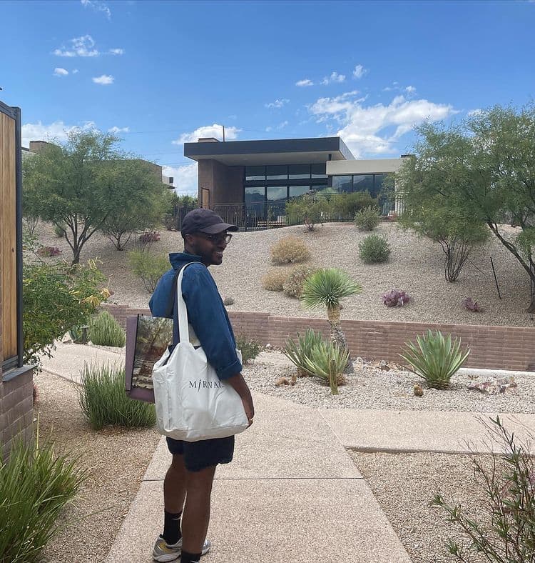 Michael Tennant at Miraval resort on path with building in background