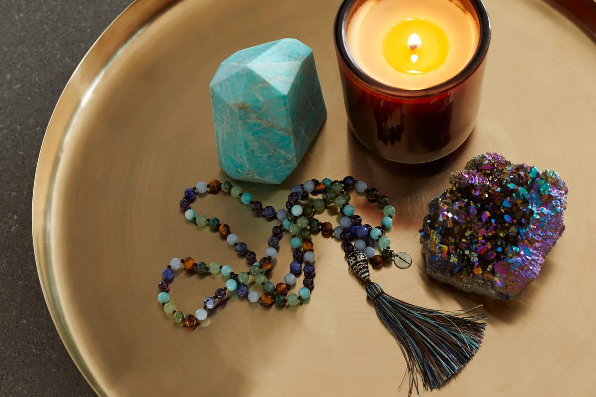 Chrystals, necklace and a candle
